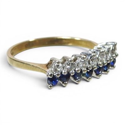 Lot 6 - A 9 carat gold sapphire and diamond ring, set...