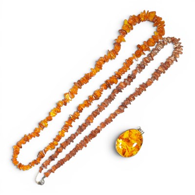 Lot 254 - An amber bead necklace, together with another...