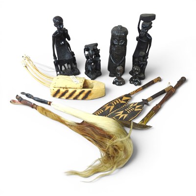 Lot 383 - A collection of African carved figures, to...