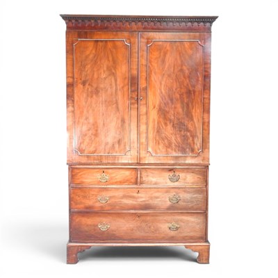 Lot 431 - A George III mahogany linen press, with a...