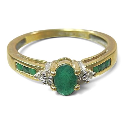 Lot 32 - A 10 carat gold emerald and diamond cluster...