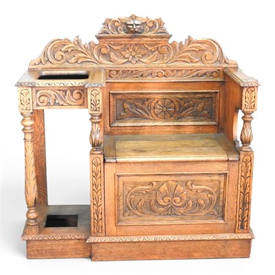 Lot 612 - An early 20th century carved oak hall stand,...