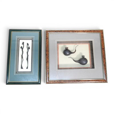 Lot 552 - Two African Kuba gourd pipes, mounted in a...