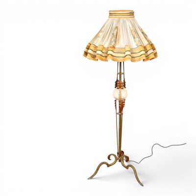 Lot 591 - A brass and glass standard lamp and shade.