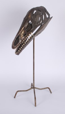 Lot 202 - A metal hand crafted compsognathus skull...