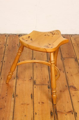 Lot 644 - A handcrafted wooden milking stool with...