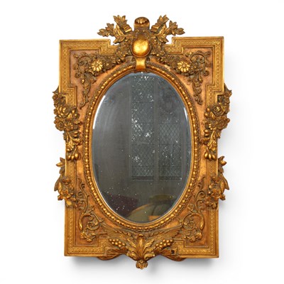 Lot 559 - A French style ornate gold gilt oval mirror...