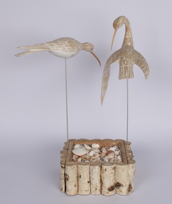 Lot 758 - A hand carved wooden bird sculpture, on a...