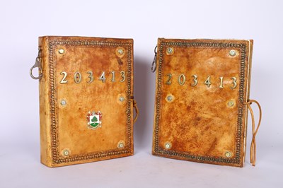 Lot 161 - Two leather bound books containing photographs,...