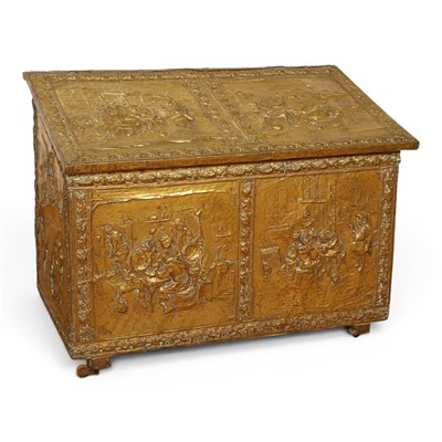 Lot 614 - A repoussé decorated brass fuel depot, w. 80cm.