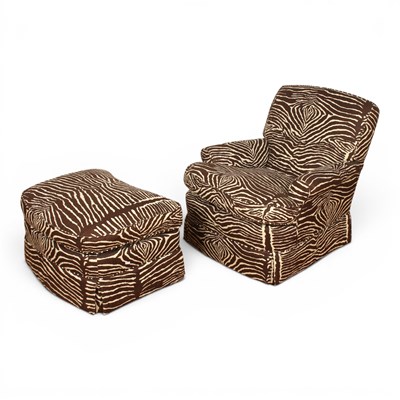 Lot 656 - A zebra patterned armchair and footstool