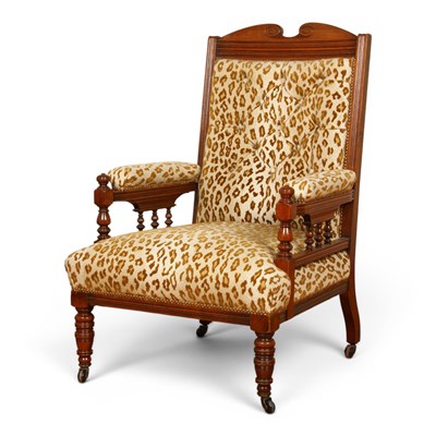 Lot 653 - A Victorian oak framed leopard print armchair