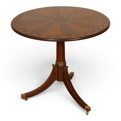 Lot 657 - A Regency style radially veneered tripod...