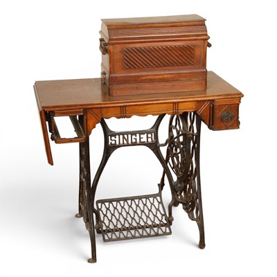 Lot 622 - A Singer sewing machine table, on a cast iron...