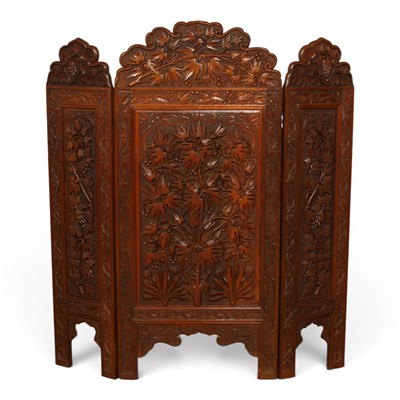 Lot 490 - An Anglo Indian heavily carved teak low three...