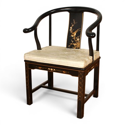 Lot 635 - A Chinese black lacquered horseshoe back armchair