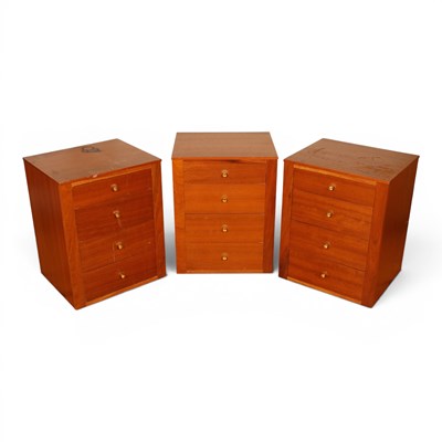 Lot 688 - A set of three teak bedside chests, 52cm