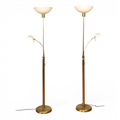 Lot 690 - A pair of brass uplighter standard lamps