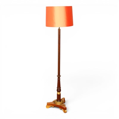 Lot 674 - A Regency style parcel gilt mahogany standard...