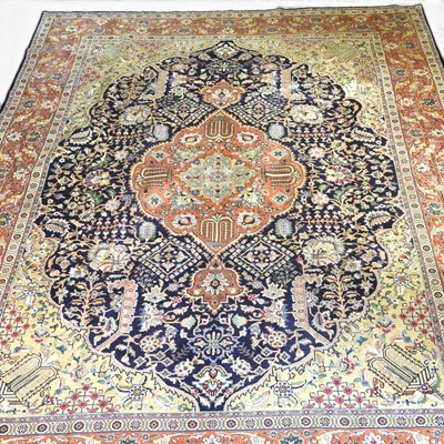 Lot 320 - A large Persian heriz carpet, with a large...