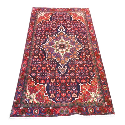 Lot 572 - A Persian sarouk rug, with a large central...