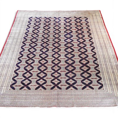 Lot 336 - A large Persian turkoman carpet, with rows of...