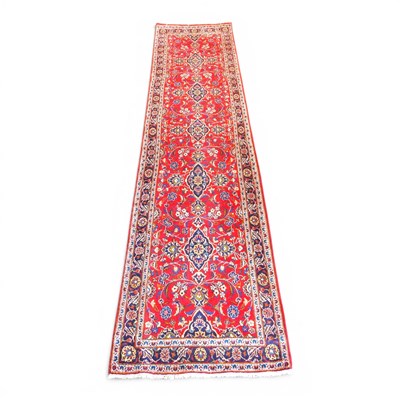 Lot 74 - A Persian kashan runner, with a row of seven...