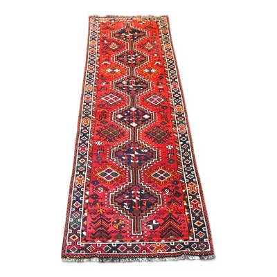 Lot 109 - A Persian qashgai runner, with a row of six...