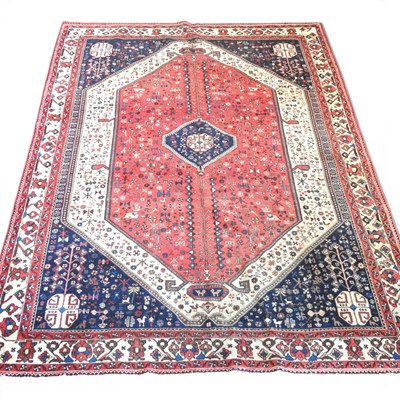 Lot 585 - A Persian carpet, with a central medallion on...
