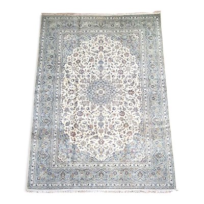Lot 540 - A large Persian Kashan carpet, profusely...