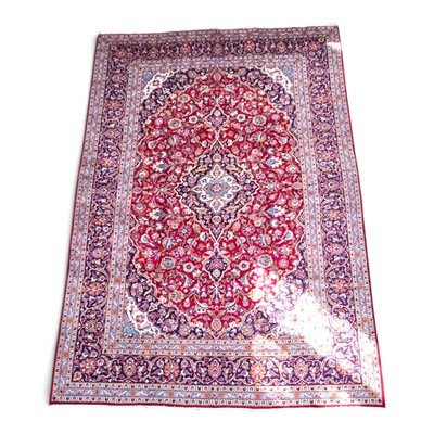 Lot 399 - A Persian Kashan carpet, with a central...