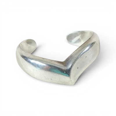 Lot 60 - A sterling silver Tiffany bangle, by Elsa...