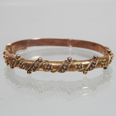 Lot 13 - An early 20th century 9 carat gold bangle
