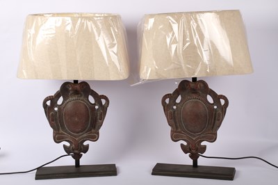 Lot 113 - A pair of metal table lamps, each in the form...