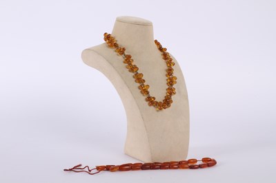 Lot 62 - Two Amber necklaces , one for repair and one...