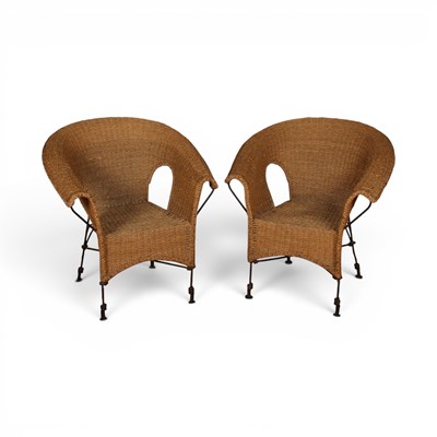 Lot 534 - A pair of rattan arm chairs with a wrought...