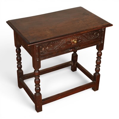Lot 650 - An 18th century dark oak side table, having a...