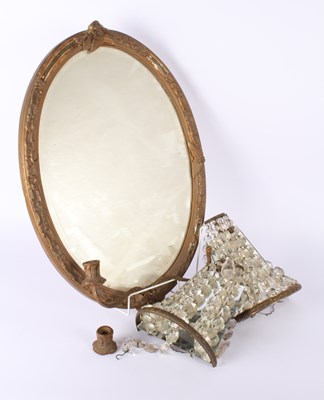 Lot 645 - A Victorian oval gilt mirror with candle...