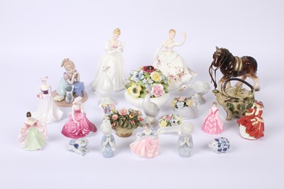 Lot 730 - A collection of ceramic figures, including...