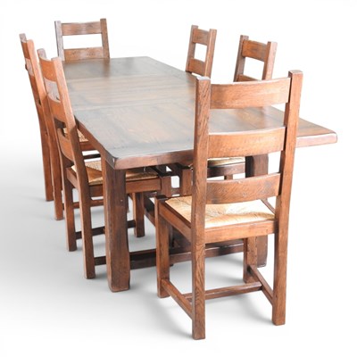 Lot 193 - A modern oak extending dining table, with two...