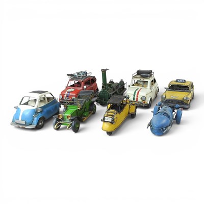 Lot 579 - A collection of eight tinplate model cars and...