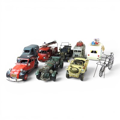 Lot 237 - A collection of tin model vehicles, the...