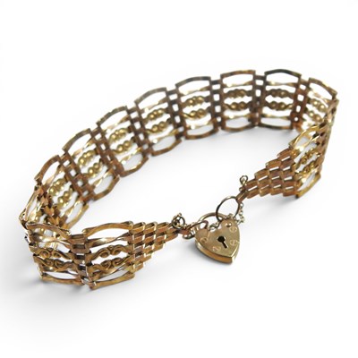 Lot 1 - A 9 carat gold fancy link gate bracelet, with...