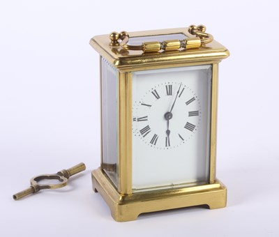 Lot 155 - A brass carriage clock, having an enamel dial...