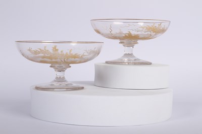 Lot 132 - A pair of glass champagne coupe glasses,...