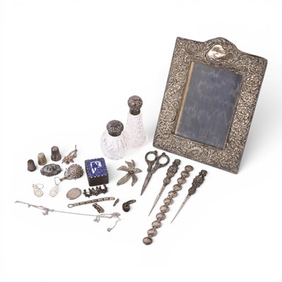 Lot 70 - A collection of silver and white metal items,...