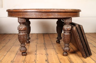 Lot 558 - A large Carolean style oak extending dining...