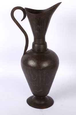 Lot 769 - A middle eastern etched metal ewer, with...