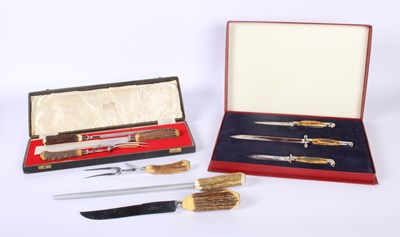 Lot 705 - Two vintage cutlery sets featuring stag horn...