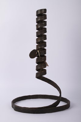 Lot 708 - A wrought iron spiral candle holder or parasol...